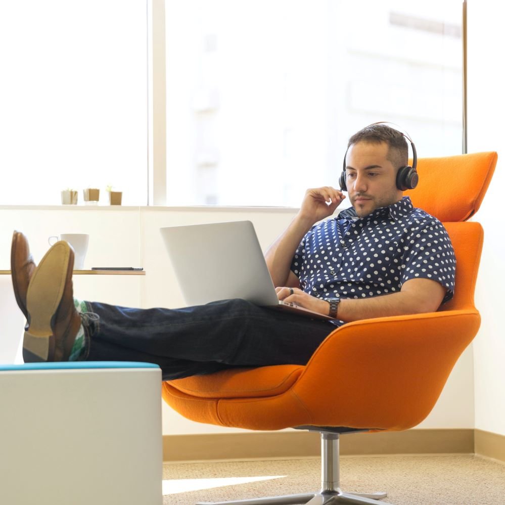 affiliate marketing vs mlm Photo by LinkedIn Sales Navigator: https://www.pexels.com/photo/man-wearing-headphones-sitting-on-orange-padded-chair-while-using-laptop-computer-1251841/