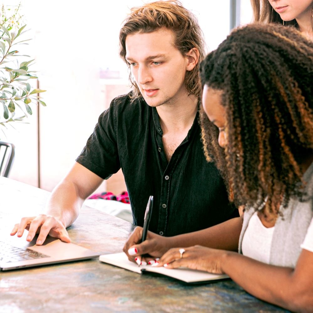 how to start affiliate marketing with no money Photo by Canva Studio: https://www.pexels.com/photo/man-working-on-laptop-while-woman-takes-notes-3153199/